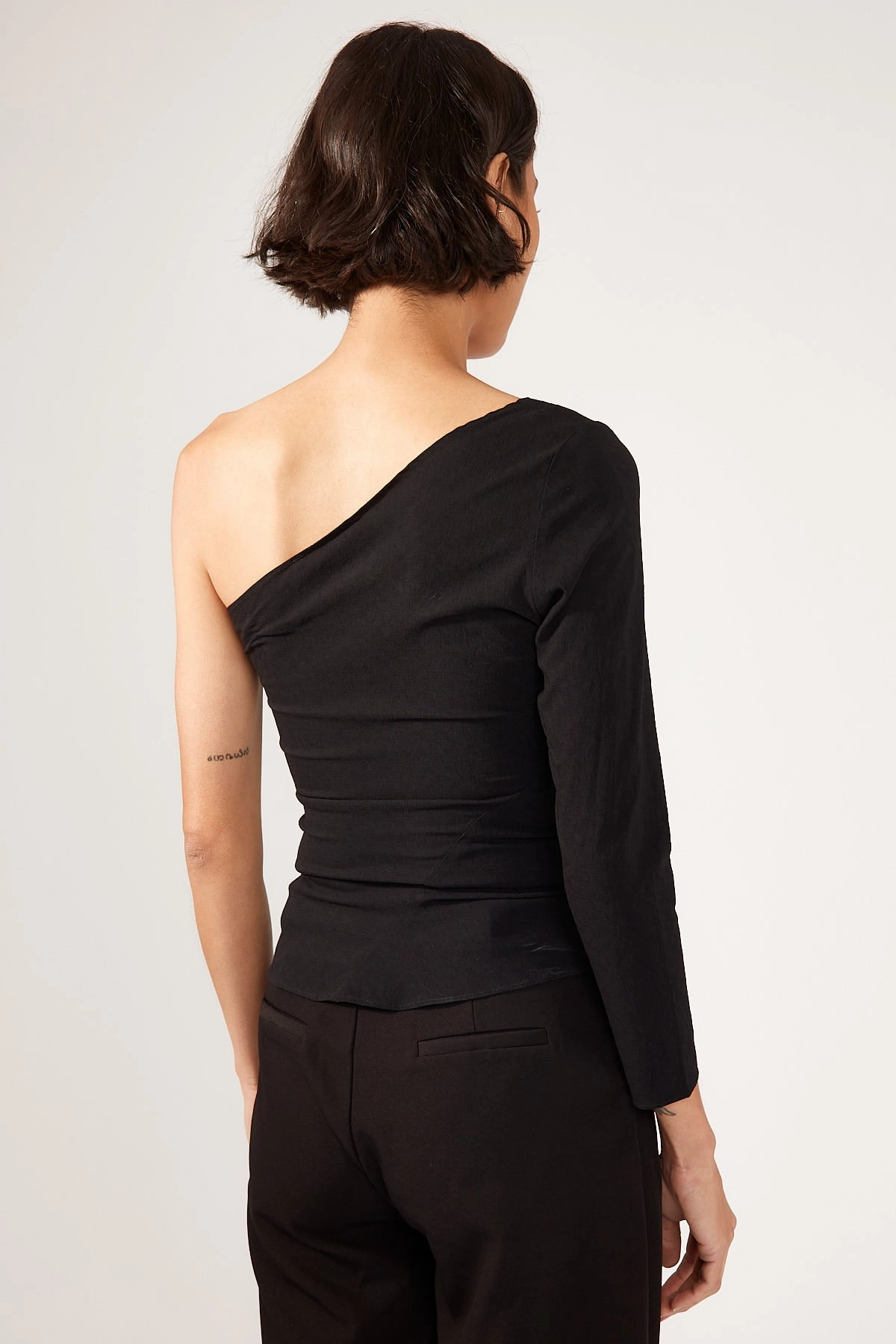 Perfect Stranger Britta Tucked Asymmetrical Top Black Machine Washable Construction