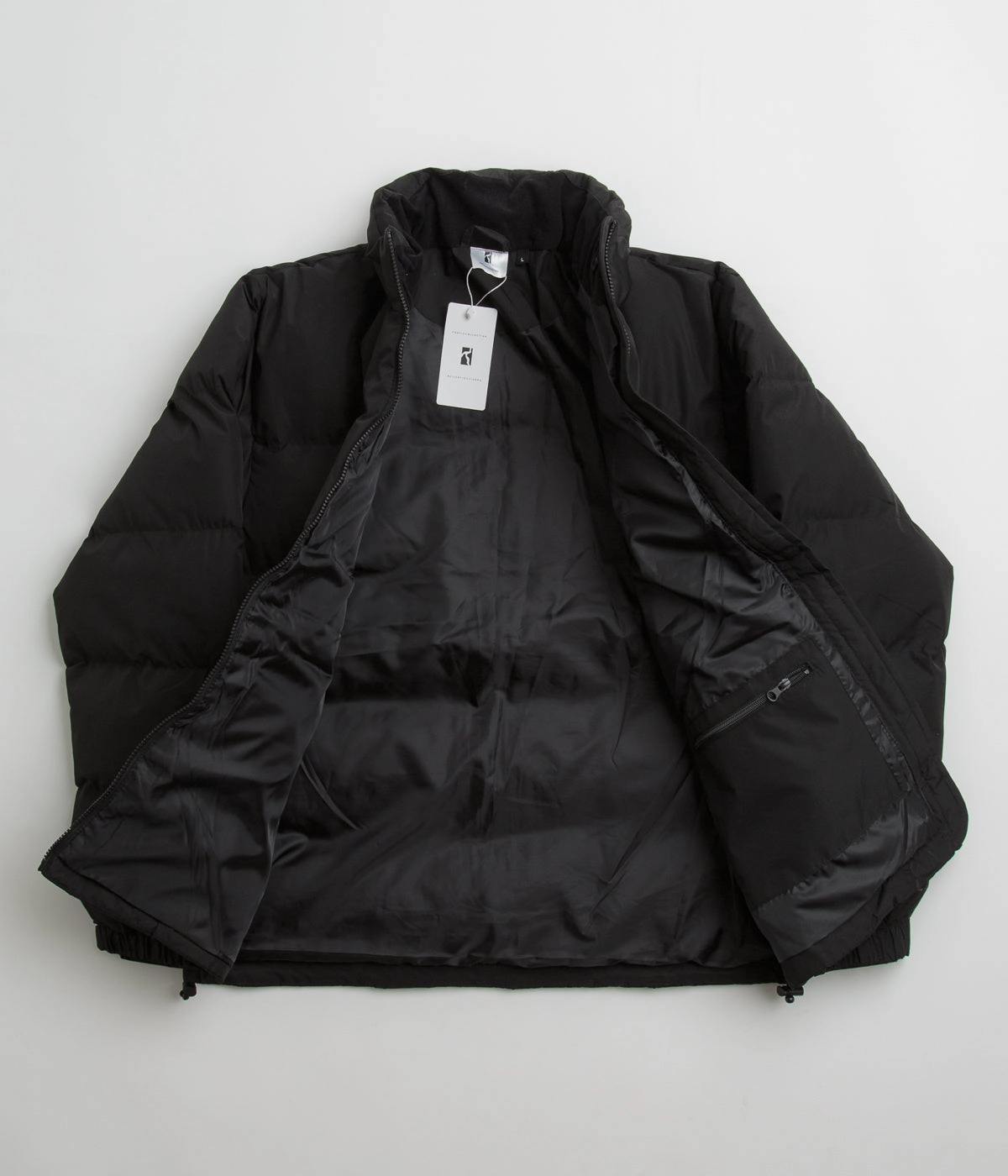 Poetic Collective Puffer Jacket - Black / White Adjustable Hood
